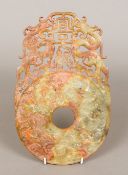 A Chinese carved russet jade bi disc The typical carved roundel beneath pierced carved dragons. 31.