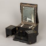 A 19th century ebonised Indian carved travelling work/dressing box Profusely carved with scrolling