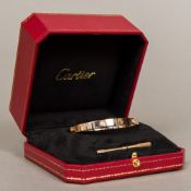 A Cartier four stone diamond set 18 ct gold love bracelet, signed,