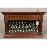 A Victorian/Edwardian carved walnut wall mounted display cabinet Carved with crossed spoons and the