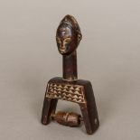 An African Baoule tribe of the Ivory Coast carved wooden heddle pulley The handle typically formed