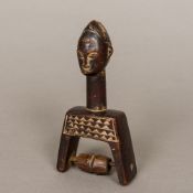 An African Baoule tribe of the Ivory Coast carved wooden heddle pulley The handle typically formed