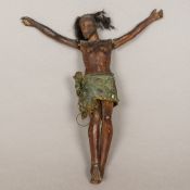 A 19th century Continental folk wood carving of Christ Typically modelled. 25 cm high.