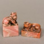 A Chinese carved soapstone seal Of rectangular section form topped with a dog-of-fo and with carved