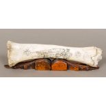 A scrimshaw bone Decorated with a sailor with ships beyond and inscribed "Salem" and bearing date