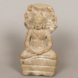 A Gandharan carved stone figure of Buddha Typically modelled in the lotus position before a