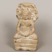 A Gandharan carved stone figure of Buddha Typically modelled in the lotus position before a