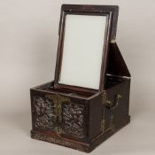 A late 19th century Chinese carved hardwood travelling dressing box The hinged top enclosing a