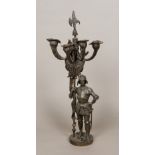 A 19th century patinated bronze candelabra Of five branch form, formed as a knight in armour.