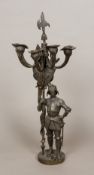 A 19th century patinated bronze candelabra Of five branch form, formed as a knight in armour.