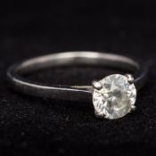 A platinum and diamond solitaire ring The claw set stone approximately 1 carat, colour G-H,