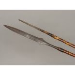 Two African tribal, possibly Maasai, spears Each of double ended form,