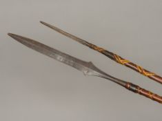 Two African tribal, possibly Maasai, spears Each of double ended form,