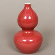 A small Chinese porcelain double gourd vase With allover red glaze,