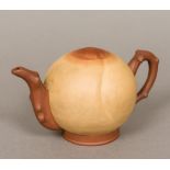 An unusual Chinese Yixing pottery teapot Of solid domed form with loop handle and spout,