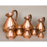 A set of eight 19th century copper harvest jugs Comprising: one gallon, half, quart, pint,