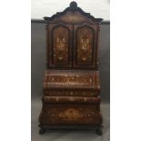 An Italian ivory and marquetry inlaid bureau cabinet The carved top rail above the inlaid panel and