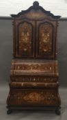 An Italian ivory and marquetry inlaid bureau cabinet The carved top rail above the inlaid panel and