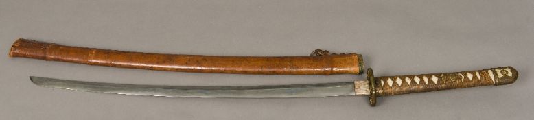 A World War II Japanese officer's katana sword Of typical form,