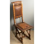 A 19th century North African bone inlaid side chair The pierced carved leather upholstered back