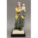 CHARLES VYSE (1882-1971) A Chelsea pottery figure of a gypsy woman and child The underside with