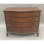 A George III mahogany serpentine fronted chest of drawers The shaped box string top above the four