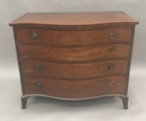 A George III mahogany serpentine fronted chest of drawers The shaped box string top above the four