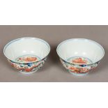 A pair of Chinese porcelain bowls Polychrome decorated with dragons interspersed with phoenixes,