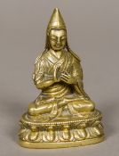An 18th century or earlier gilt bronze figure of Je Tsongkhapa (1357-1419) Tibetan The Buddhist