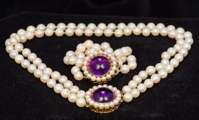 A two strand pearl bead necklace With amethyst set 750 gold clasp;