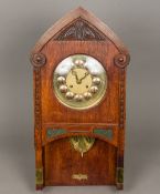 A Continental Arts & Crafts oak cased wall clock by Gustav Becker The 8 1/2 inch brass and copper