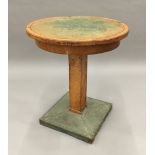 An Art Deco coper mounted side table The green leather inset circular top above the central square