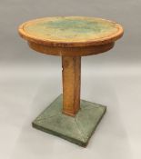 An Art Deco coper mounted side table The green leather inset circular top above the central square