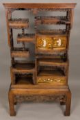 A Japanese Meiji period shibyama and lacquer decorated shodhana cabinet Set with an arrangement of