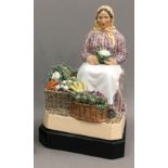 CHARLES VYSE (1882-1971) A Chelsea pottery figure of a female vegetable seller Signed C VYSE,