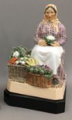 CHARLES VYSE (1882-1971) A Chelsea pottery figure of a female vegetable seller Signed C VYSE,