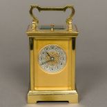 A 19th century brass cased hour repeating carriage clock The silvered dial with Arabic numerals