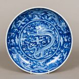 A Chinese blue and white porcelain dished plate Decorated with dragons chasing flaming pearls