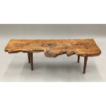 A rustic country yewwood bench/window seat Of basic gnarled plank form,
