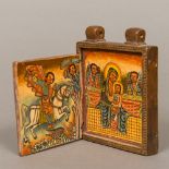 A carved wood Coptic travelling icon The geometrically carved front and back enclosing religious