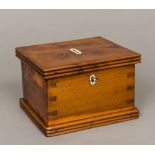 An early 19th century yewwood money box The hinged cover with reeded edge,