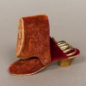 A Victorian velvet covered sewing necessaire Formed as a shoe,