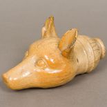 A 19th century stoneware pottery flask Formed as a fox mask. 18.5 cm long.