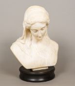 A 19th century carved marble bust Modelled as a young lady wearing a florally embroidered headdress,