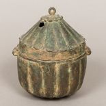 An 18th century Indian patinated bronze box Of ribbed circular form,