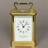 An oversized brass cased carriage clock by Charles Frodsham,