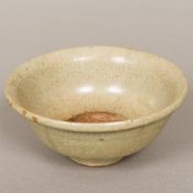 A Chinese crackle glaze pottery bowl Of flared form, with pale celadon ground. 16 cm diameter.