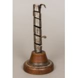 A 19th century French polished steel candlestick Of spiralling form,