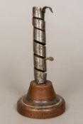 A 19th century French polished steel candlestick Of spiralling form,