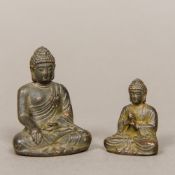 A small Chinese patinated bronze figure of Buddha Typically modelled seated in the lotus position;